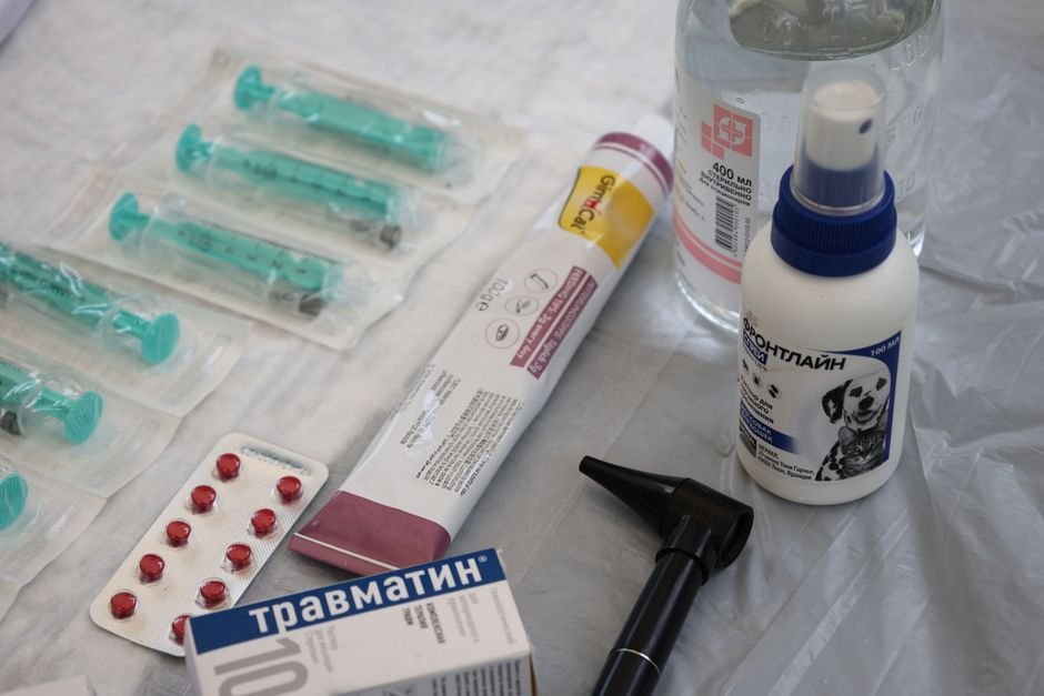 A pharmacy student preparing medications at a dispensing counter